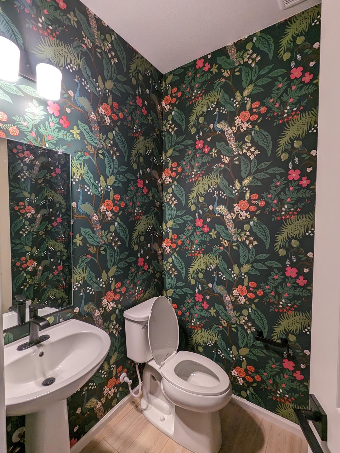 Patterned wallpaper installed in a residential bathroom interior
